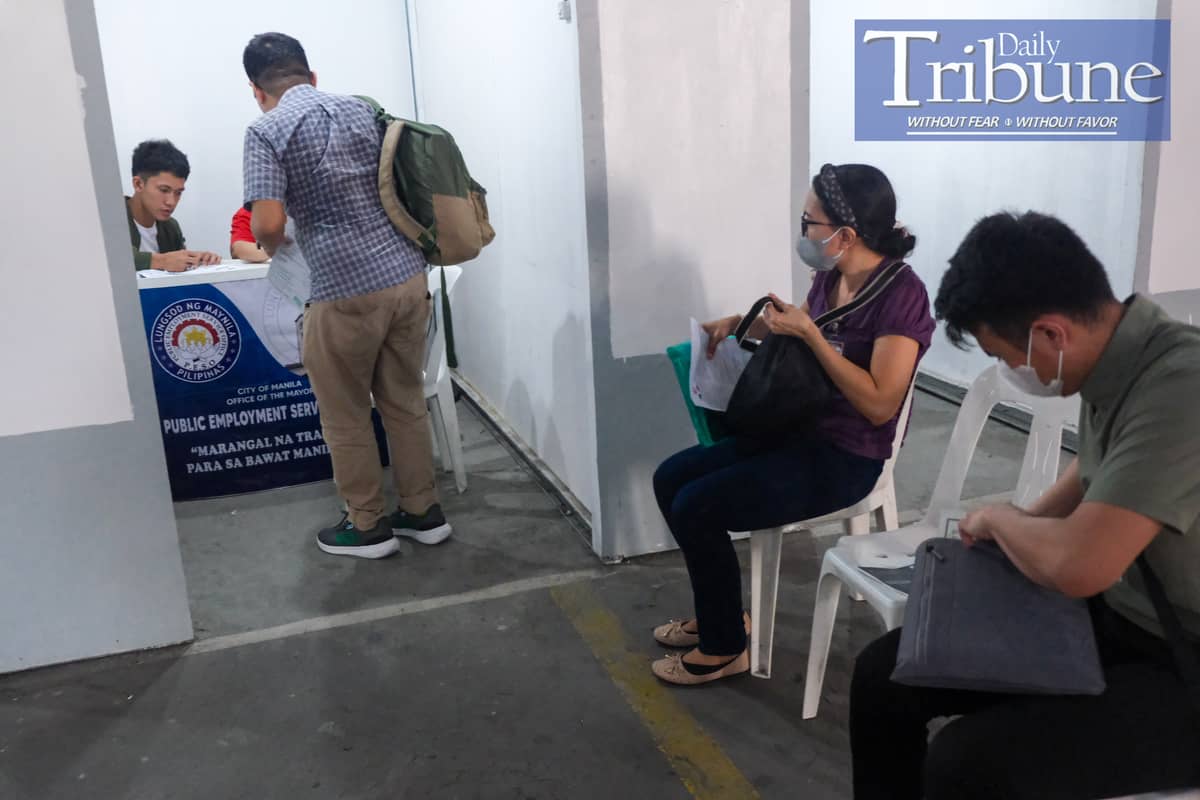 Jobseekers line up for an initial interview during a job fair of the Manila LGU at Park 'N Ride, Lawton, Manila on Tuesday, July 09, 2024. The unemployment rate in the Philippines dropped to 4.1% in May 2024, down from